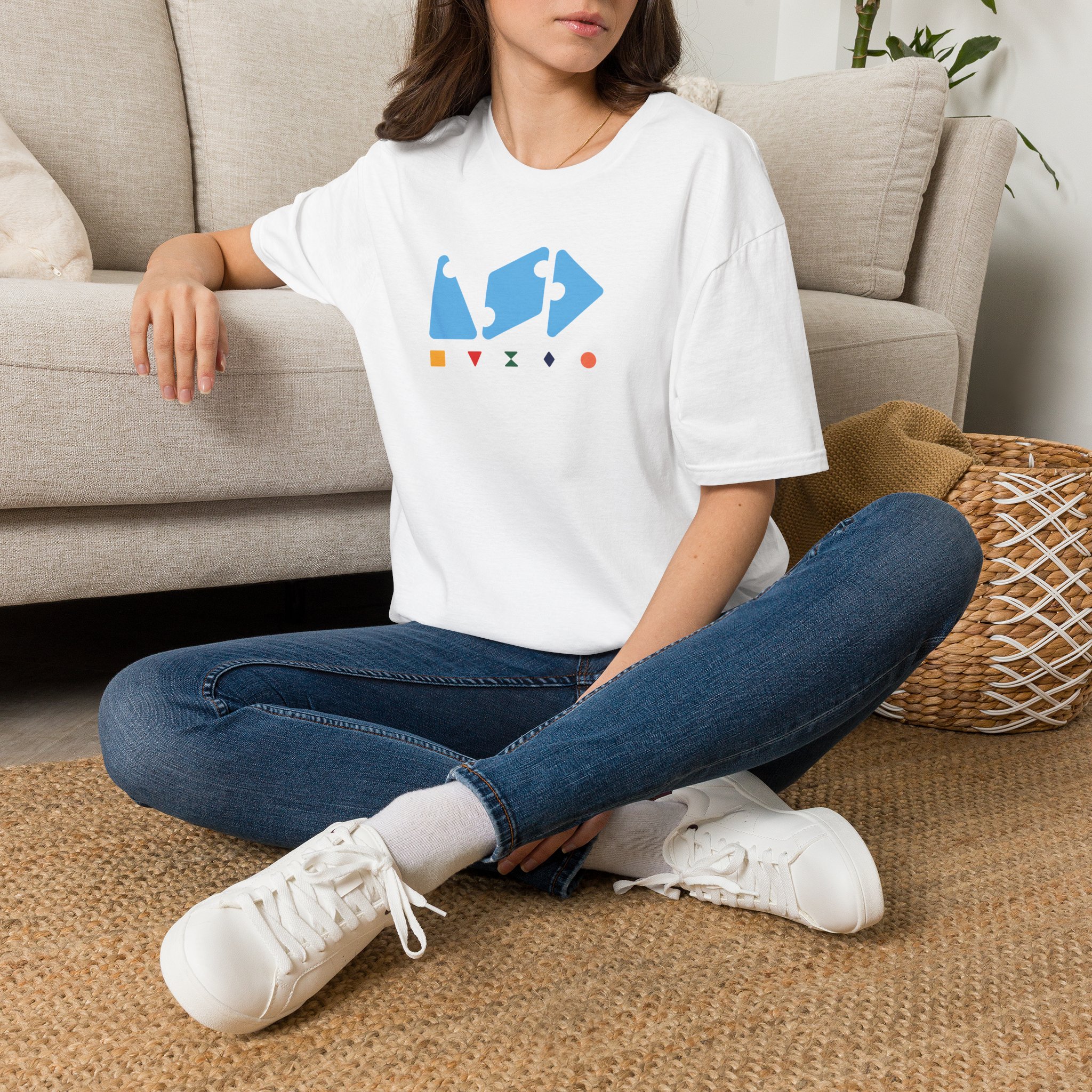 Woman sitting on rug with LSD T-shirt